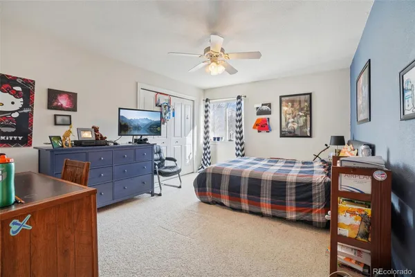 a bedroom with a bed and furniture