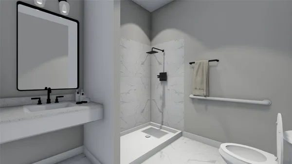 a white toilet sitting next to a bathroom sink