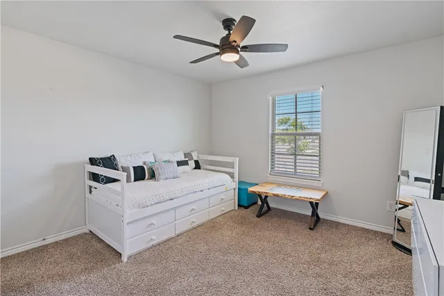 a room with a bed and a window