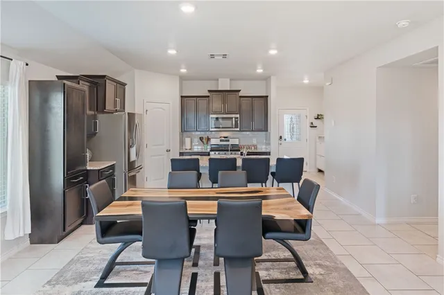 a view of a dining room with furniture