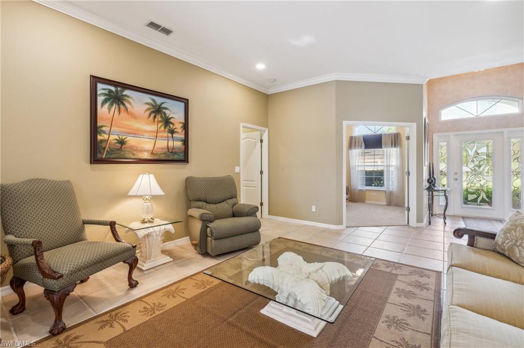 11446 Stratham Loop Estero, FL 33928 - Photo 12 of 27 a living room with furniture and a large window