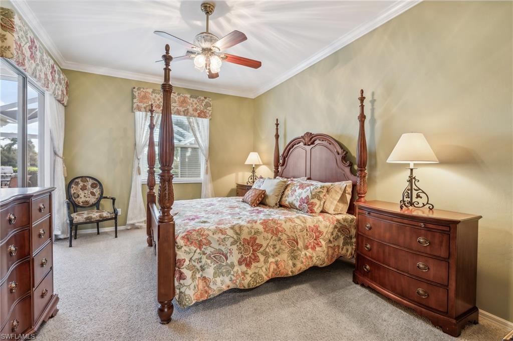 11446 Stratham Loop Estero, FL 33928 - Photo 16 of 27 a bedroom with a bed dresser and a window