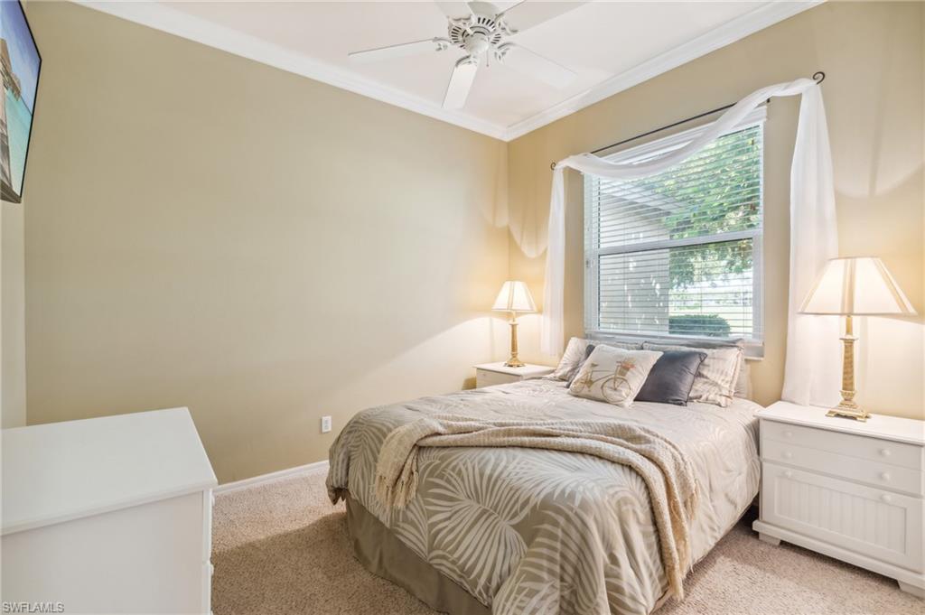 11446 Stratham Loop Estero, FL 33928 - Photo 21 of 27 a bedroom with a bed and a window