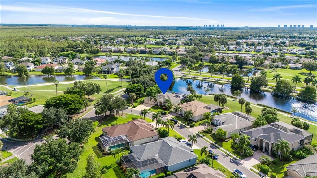 11446 Stratham Loop Estero, FL 33928 - Photo 25 of 27 an aerial view of residential houses with outdoor space and lake view