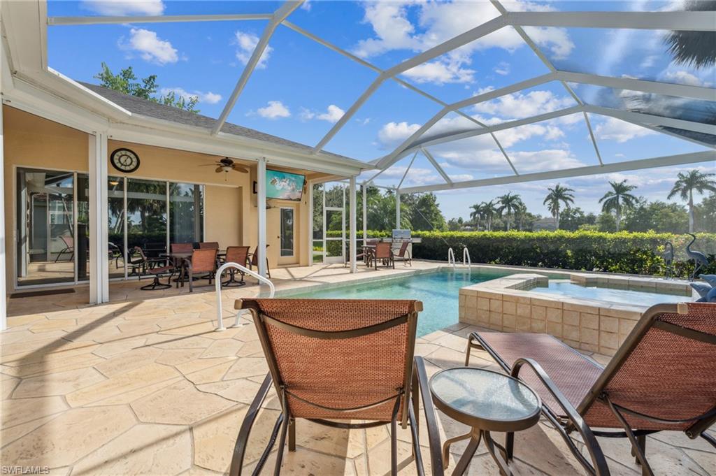11446 Stratham Loop Estero, FL 33928 - Photo 4 of 27 a outdoor patio with swimming pool and furniture