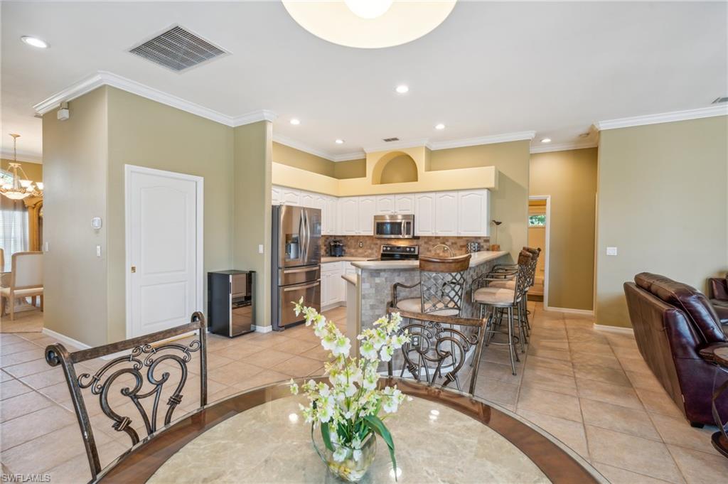 11446 Stratham Loop Estero, FL 33928 - Photo 10 of 27 a view of a dining room with furniture