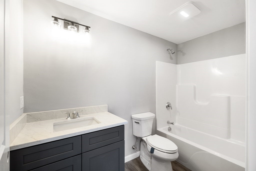 550 Spring Street, Unit 2 Fall River, MA 02721 - Photo 13 of 23 a bathroom with a sink a toilet and shower