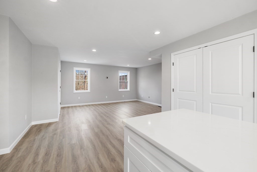 550 Spring Street, Unit 2 Fall River, MA 02721 - Photo 8 of 23 a room with a bed and a window