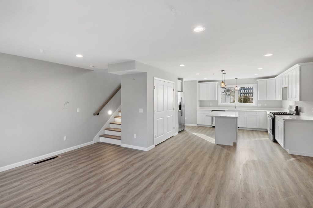 550 Spring Street, Unit 2 Fall River, MA 02721 - Photo 9 of 23 a view of kitchen with wooden floor