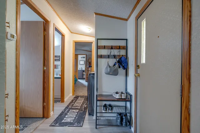 a view of a hallway and a livingroom