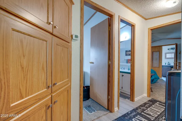 a view of a bathroom from a hallway