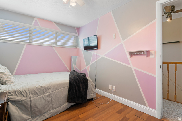 165 Pheasantbrook Drive Centerville, UT 84014 - Photo 22 of 30 Bedroom featuring a ceiling fan and wood finished floors