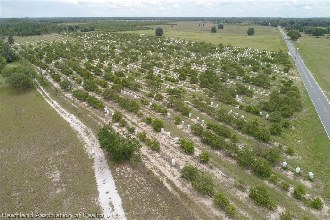 Old Avon Road Frostproof, FL 33843 - Photo 22 of 34 a view of a lake with a yard