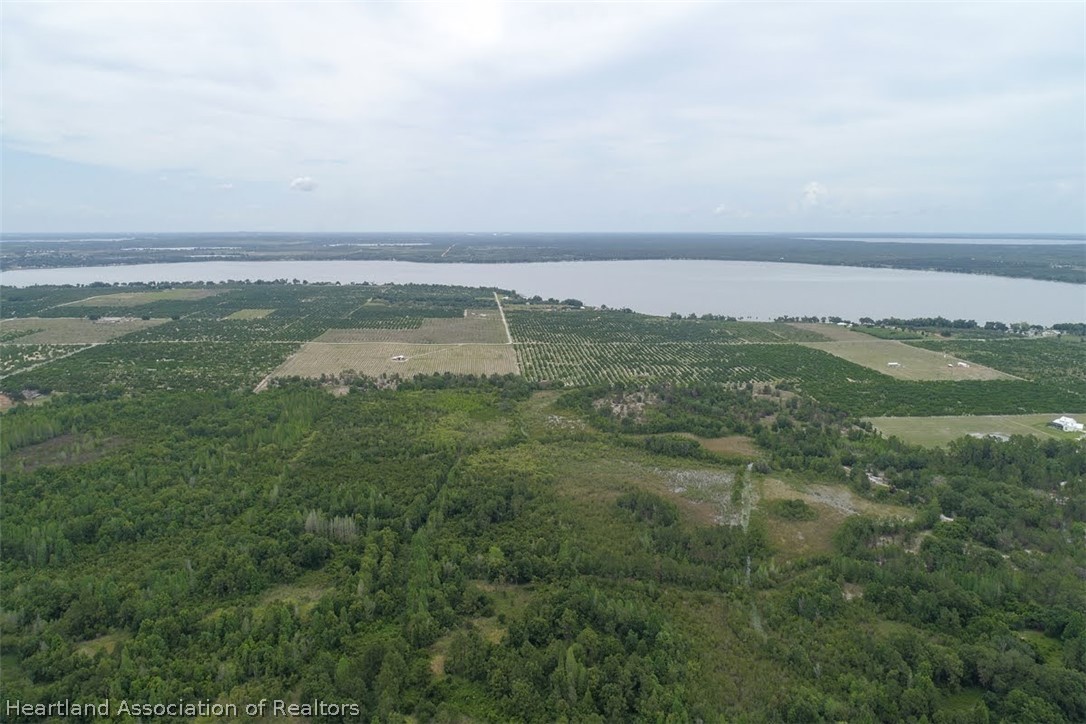 Old Avon Road Frostproof, FL 33843 - Photo 27 of 34 a view of a lake with a city