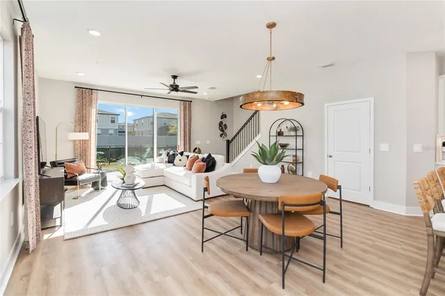 a living room with dining table