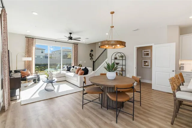 a living room with furniture a window and gym equipment