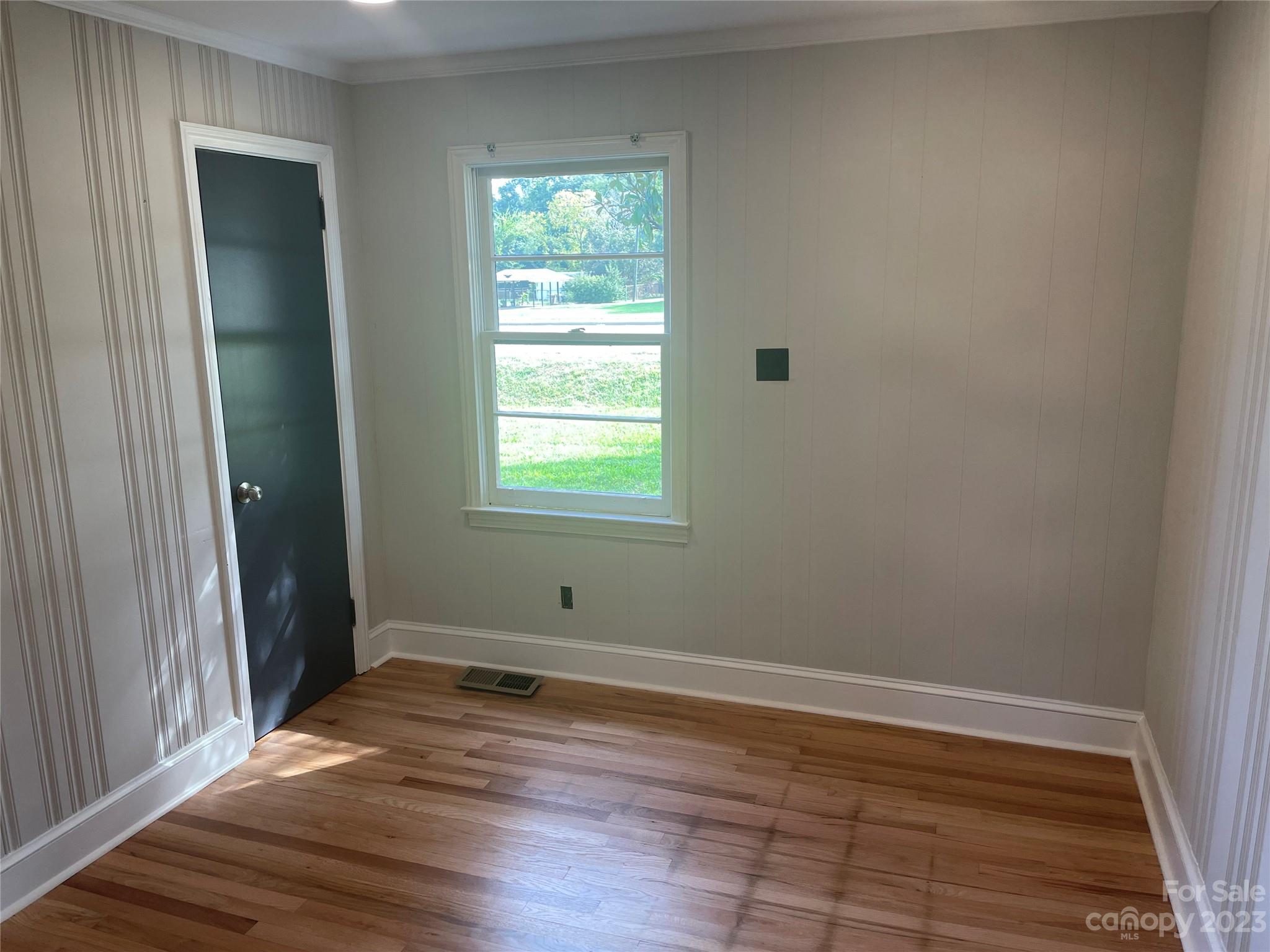 1607 Mt Gallant Road Rock Hill, SC 29732 - Photo 13 of 23 an empty room with wooden floor and a window
