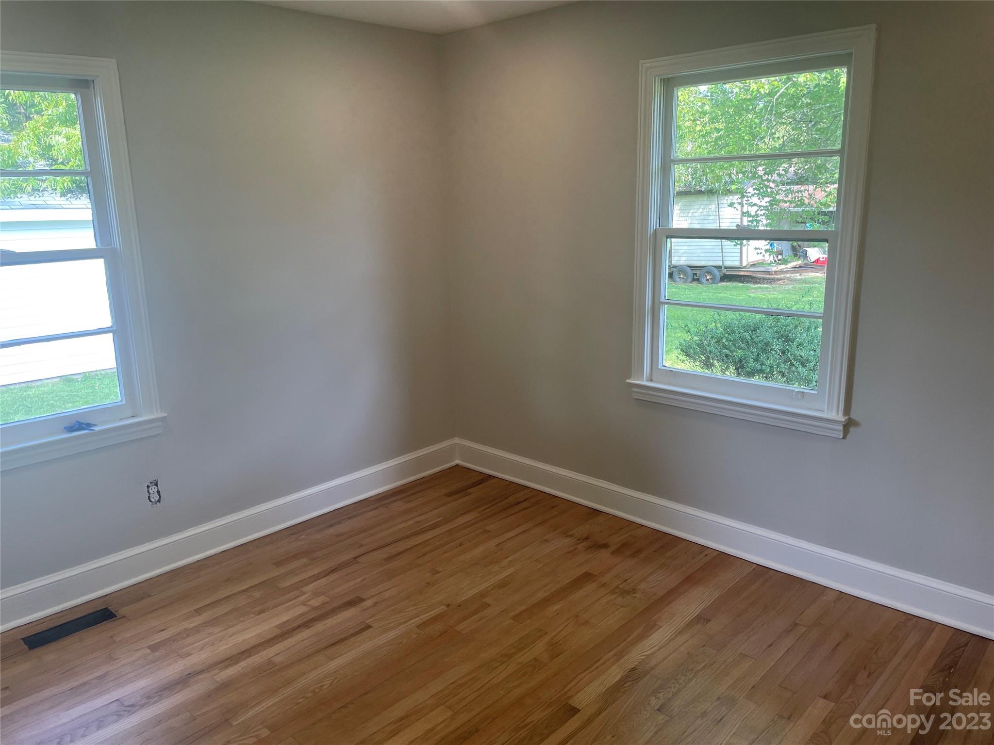 1607 Mt Gallant Road Rock Hill, SC 29732 - Photo 14 of 23 a view of an empty room with wooden floor and a window