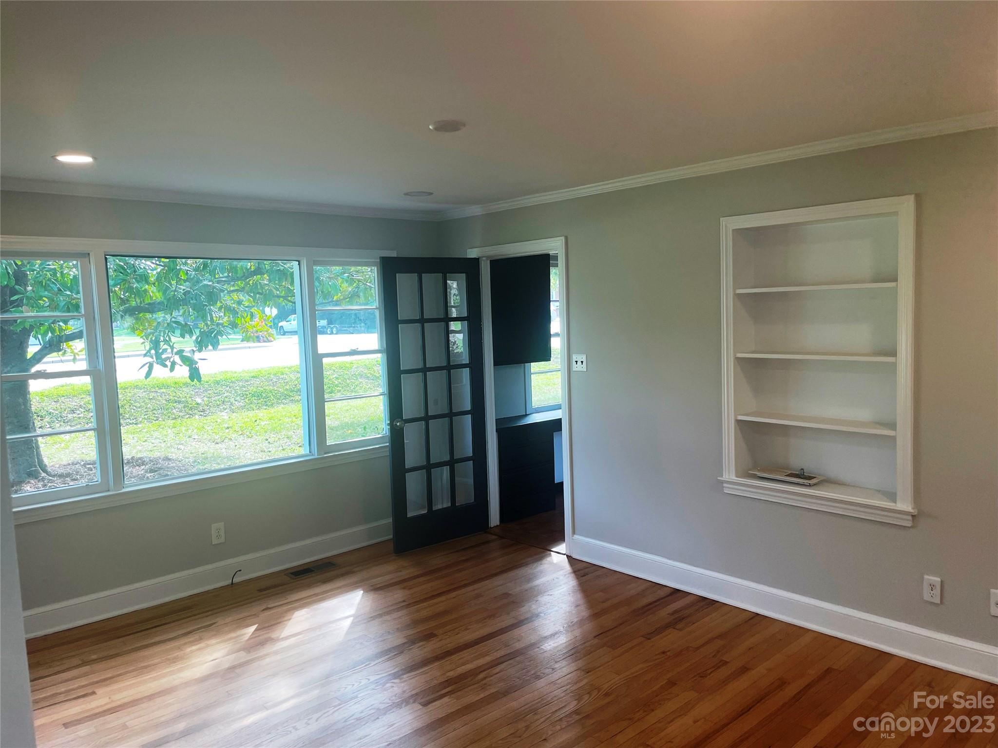 1607 Mt Gallant Road Rock Hill, SC 29732 - Photo 3 of 23 a view of an empty room with a window and wooden floor