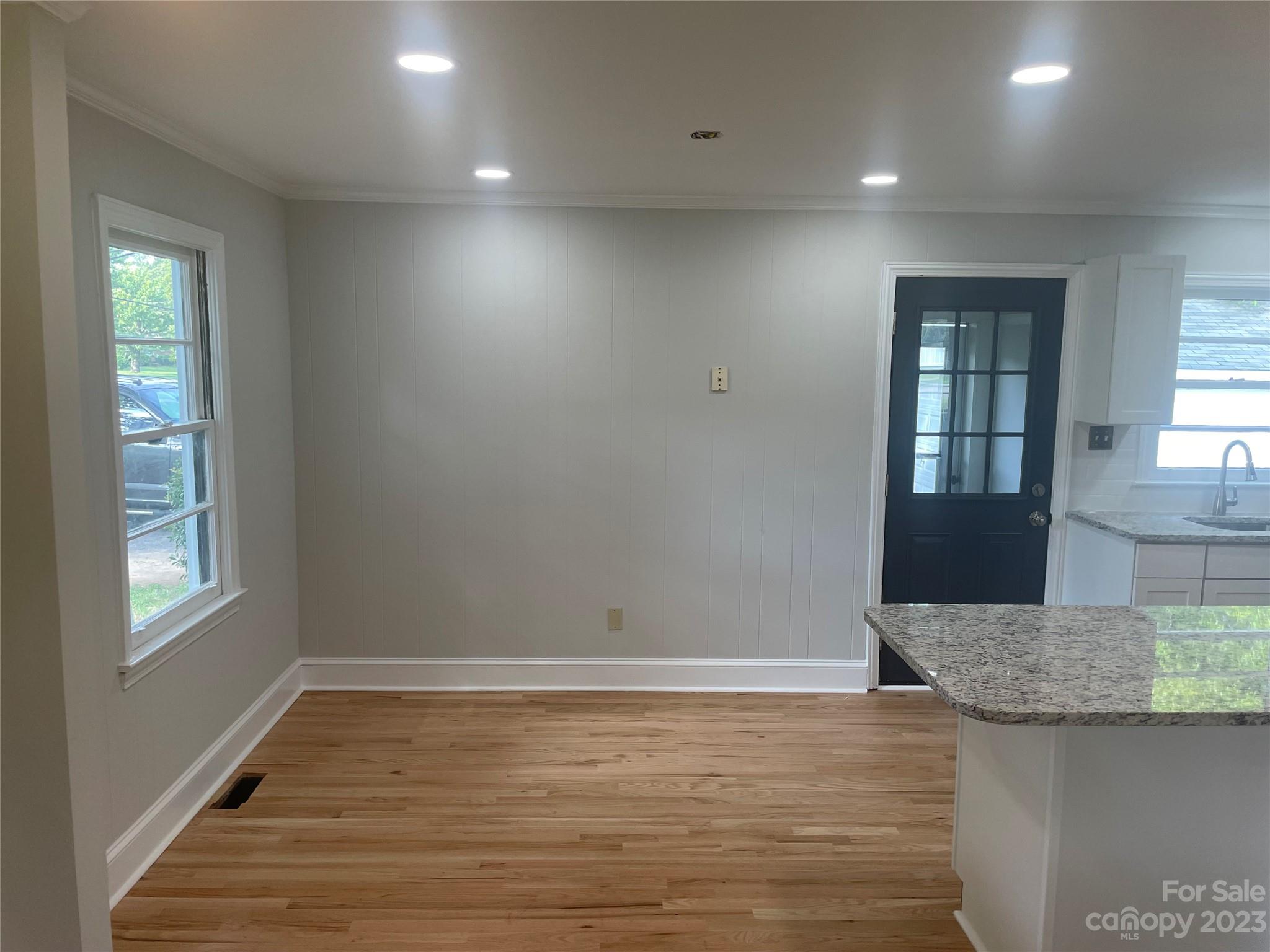 1607 Mt Gallant Road Rock Hill, SC 29732 - Photo 5 of 23 an empty room with wooden floor and windows