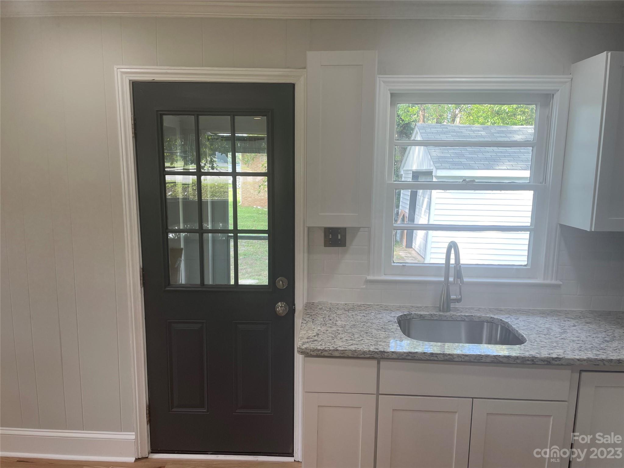 1607 Mt Gallant Road Rock Hill, SC 29732 - Photo 10 of 23 a kitchen with granite countertop a sink and a window