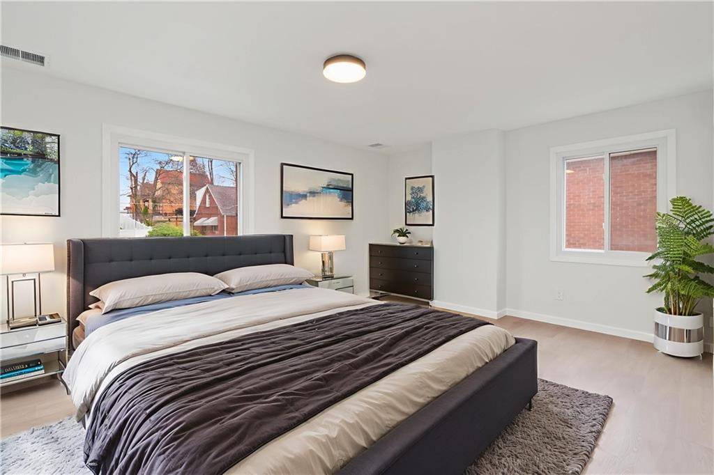 2441 Dewey Street Homestead, PA 15120 - Photo 14 of 27 a bedroom with a bed and a couch