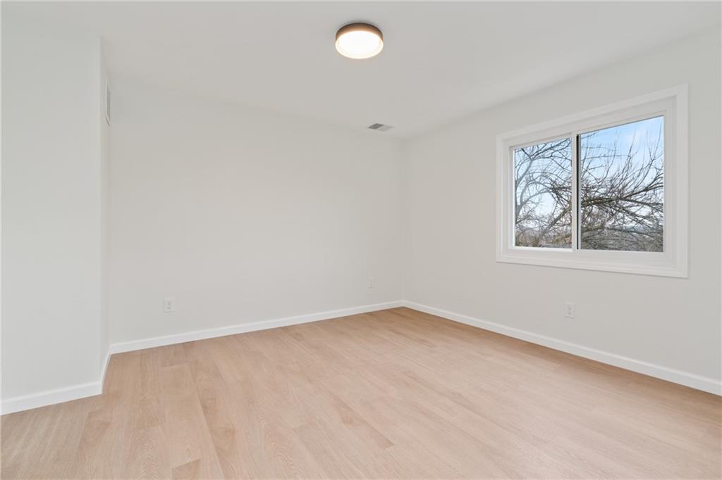 2441 Dewey Street Homestead, PA 15120 - Photo 17 of 27 an empty room with a window