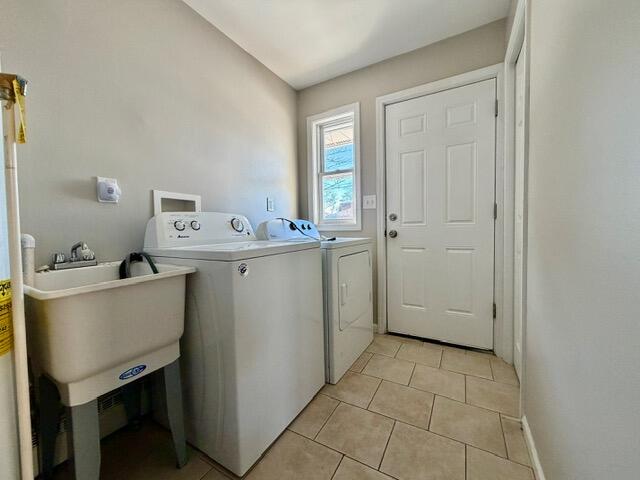 606 North Lindberg Street Griffith, IN 46319 - Photo 11 of 12 a utility room with a sink a cabinetry and a window