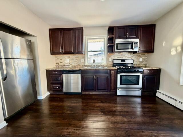 606 North Lindberg Street Griffith, IN 46319 - Photo 5 of 12 a kitchen with stainless steel appliances granite countertop a stove a sink dishwasher a refrigerator and a microwave