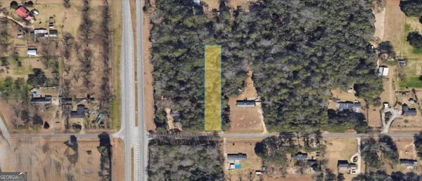 a bird view of house with yard