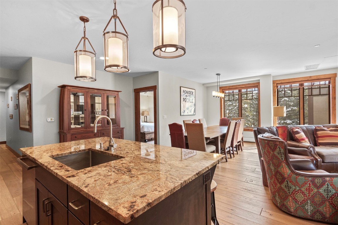 610 Columbine Road, Unit 6308 Breckenridge, CO 80424 - Photo 11 of 49 a kitchen with a table chairs and a dining table