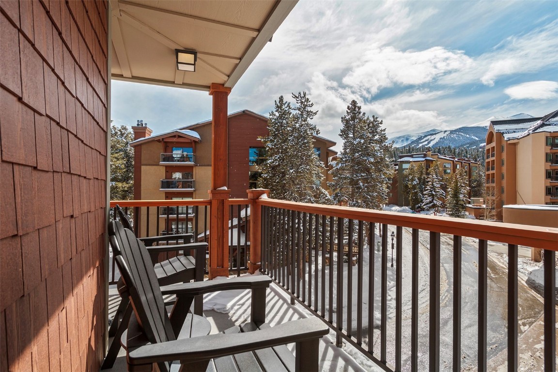 610 Columbine Road, Unit 6308 Breckenridge, CO 80424 - Photo 12 of 49 a view of balcony with wooden floor and fence