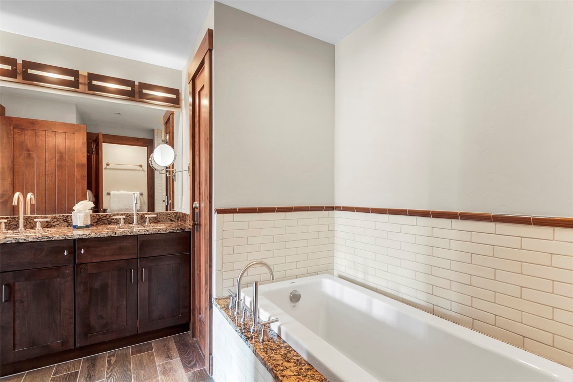 610 Columbine Road, Unit 6308 Breckenridge, CO 80424 - Photo 21 of 49 a bathroom with a bathtub and a sink
