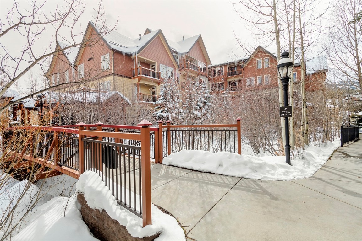 610 Columbine Road, Unit 6308 Breckenridge, CO 80424 - Photo 28 of 49 a view of a brick house with iron stairs