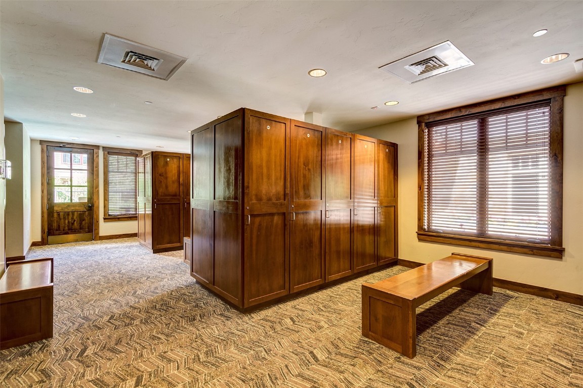 610 Columbine Road, Unit 6308 Breckenridge, CO 80424 - Photo 39 of 49 a spacious bedroom with a bed and glass windows