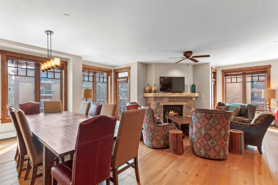 610 Columbine Road, Unit 6308 Breckenridge, CO 80424 - Photo 6 of 49 a view of a dining room with furniture window and wooden floor