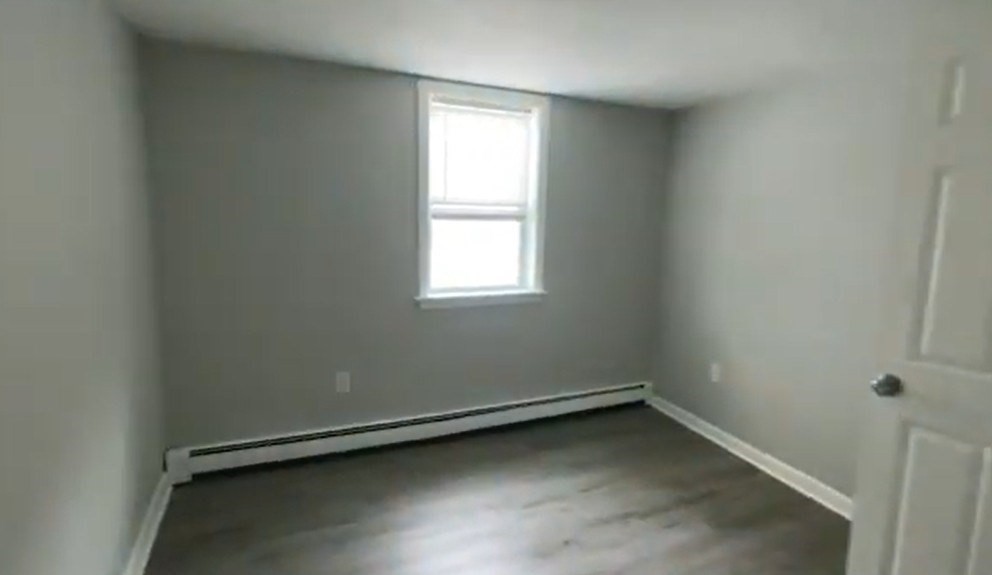 155 Onset Avenue, Unit E Wareham, MA 02558 - Photo 4 of 5 an empty room with a window