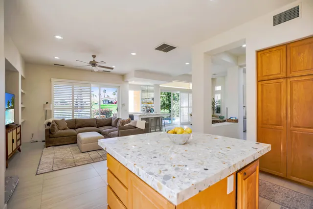 a view of kitchen island with granite countertop furniture and living room