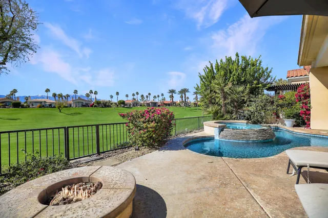 a view of a garden with a fountain and a garden