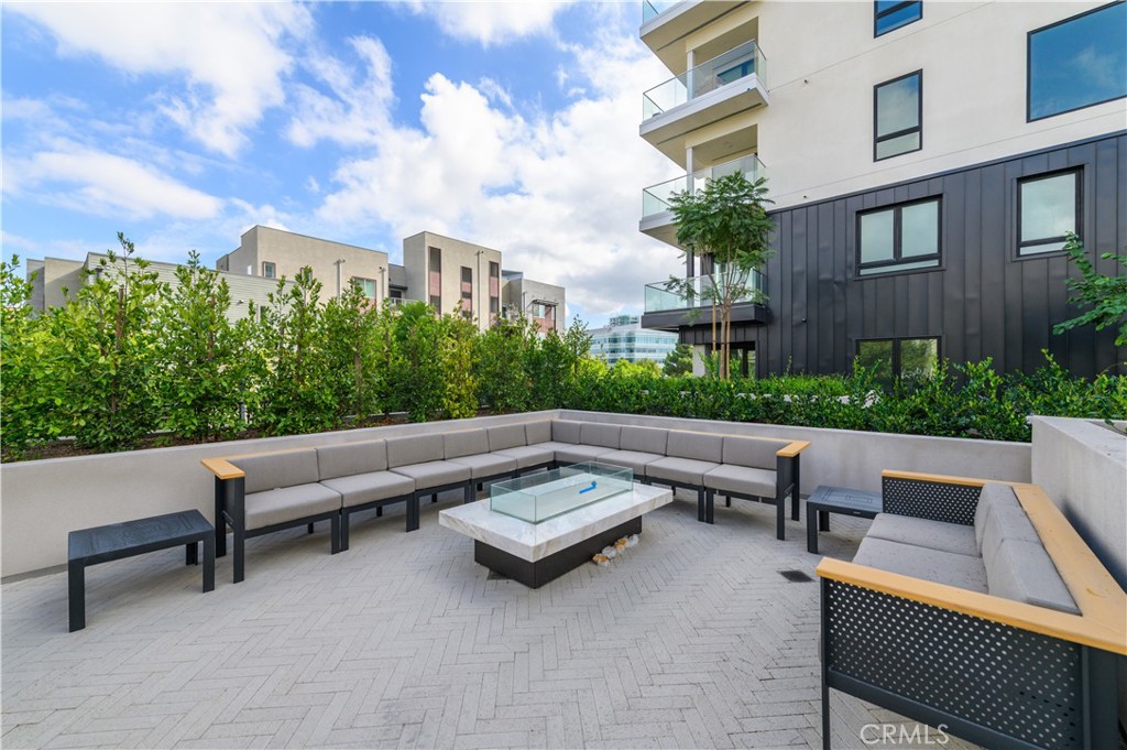 3608 Rivington Irvine, CA 92612 - Photo 65 of 74 a view of a bench in back yard of a building