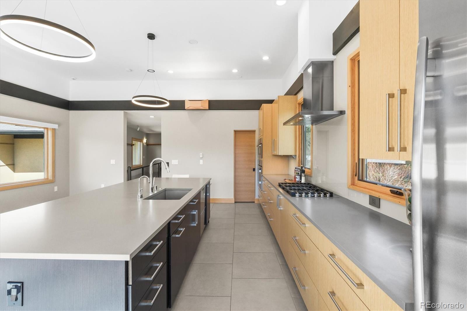 682 Buddy Road Bailey, CO 80421 - Photo 11 of 50 a large white kitchen with a large window