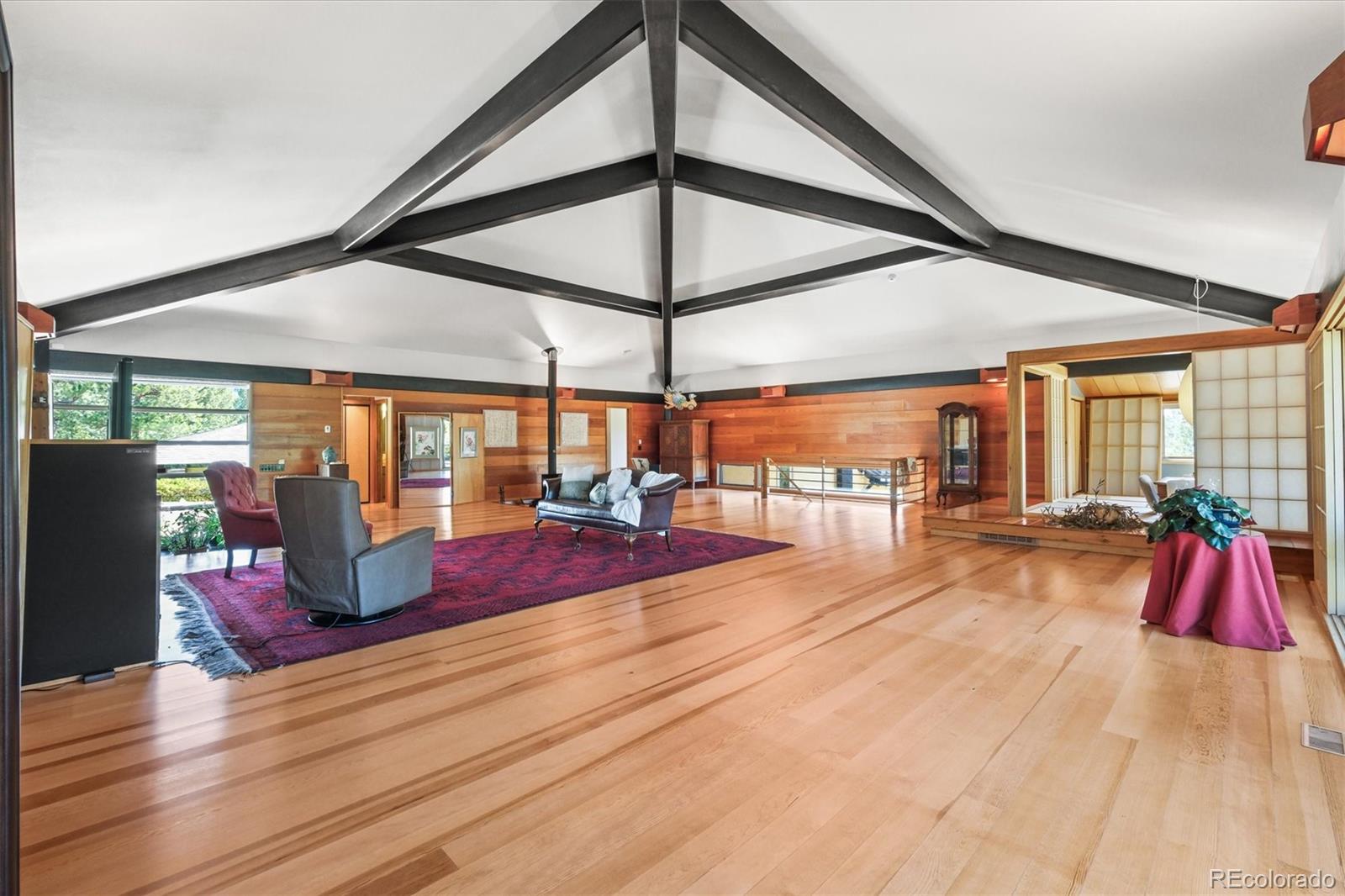 682 Buddy Road Bailey, CO 80421 - Photo 17 of 50 a very nice looking room with large windows and furniture