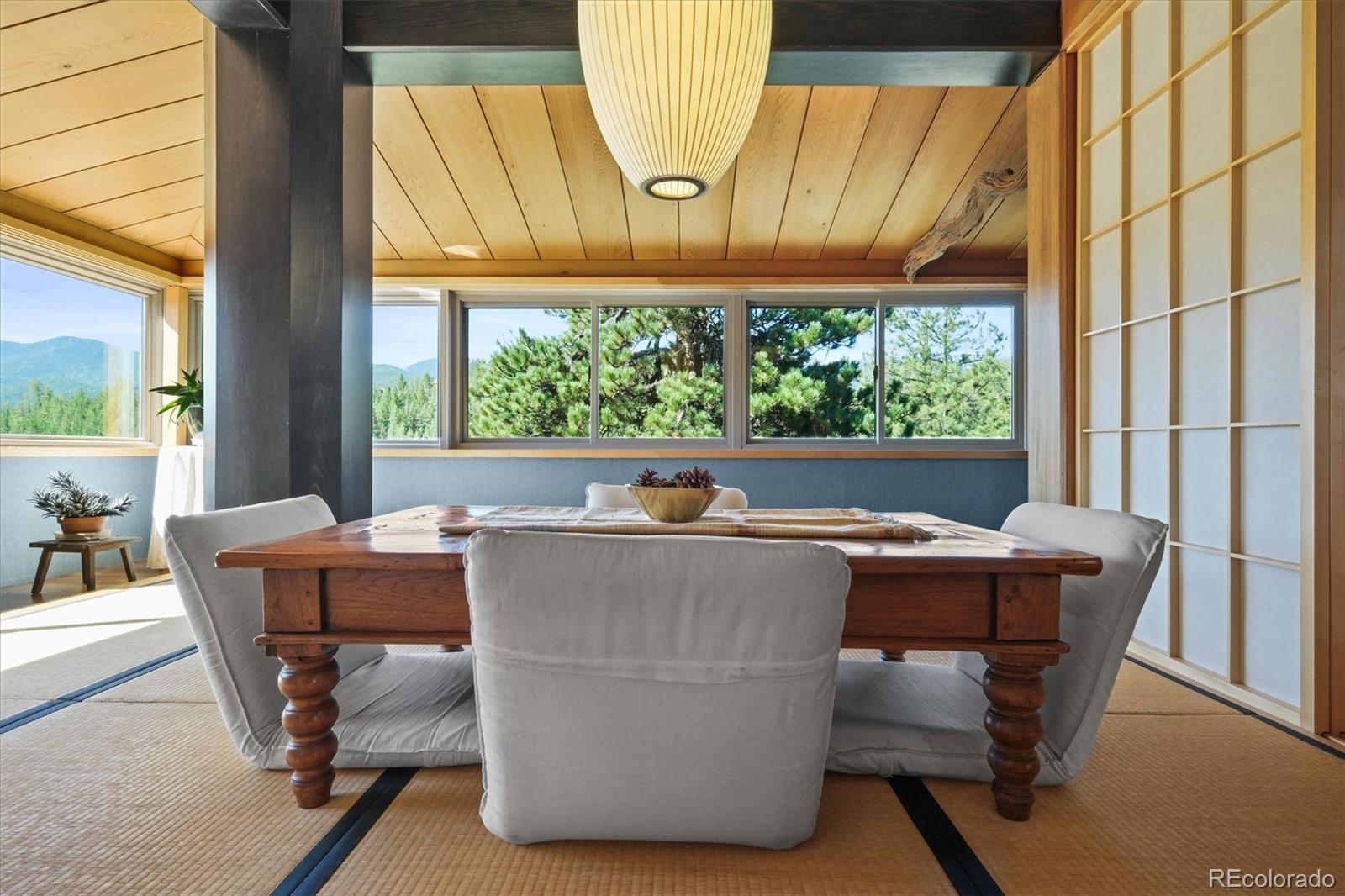 682 Buddy Road Bailey, CO 80421 - Photo 20 of 50 a living room with a table and chairs