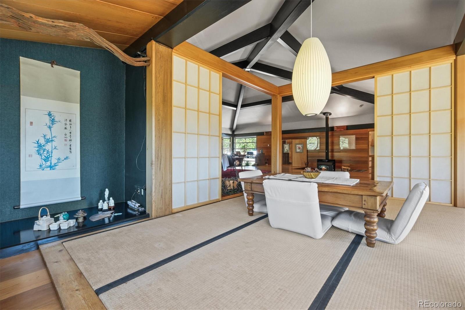 682 Buddy Road Bailey, CO 80421 - Photo 21 of 50 a living room with a couch and a table