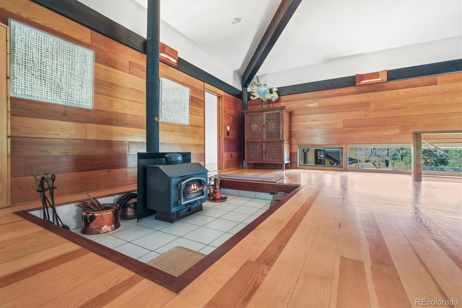 682 Buddy Road Bailey, CO 80421 - Photo 25 of 50 a dining room with table or chairs and potted plants