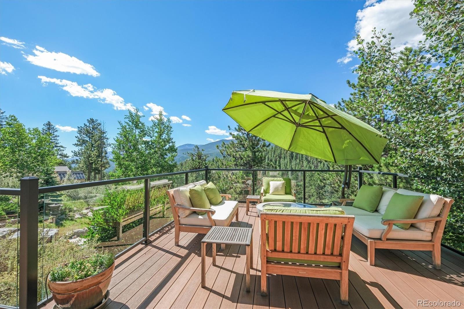 682 Buddy Road Bailey, CO 80421 - Photo 3 of 50 a view of deck with furniture and umbrella