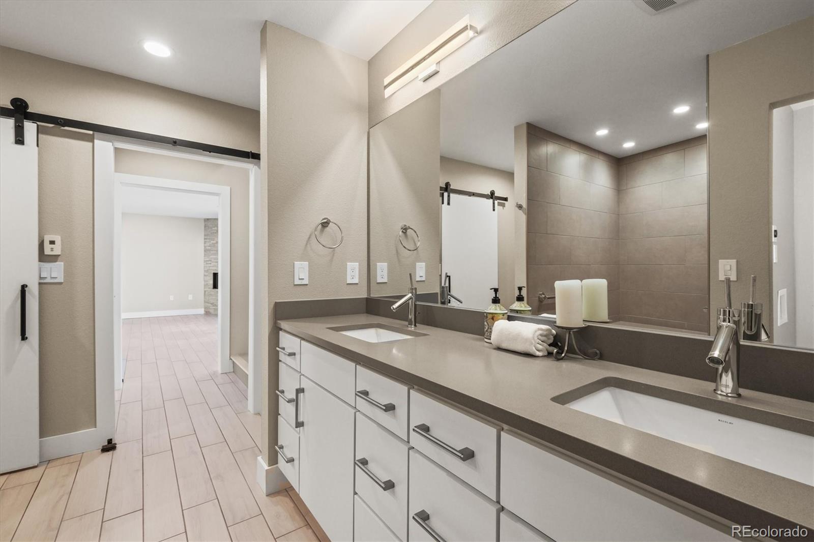 682 Buddy Road Bailey, CO 80421 - Photo 33 of 50 a bathroom with double vanity sinks and a mirror