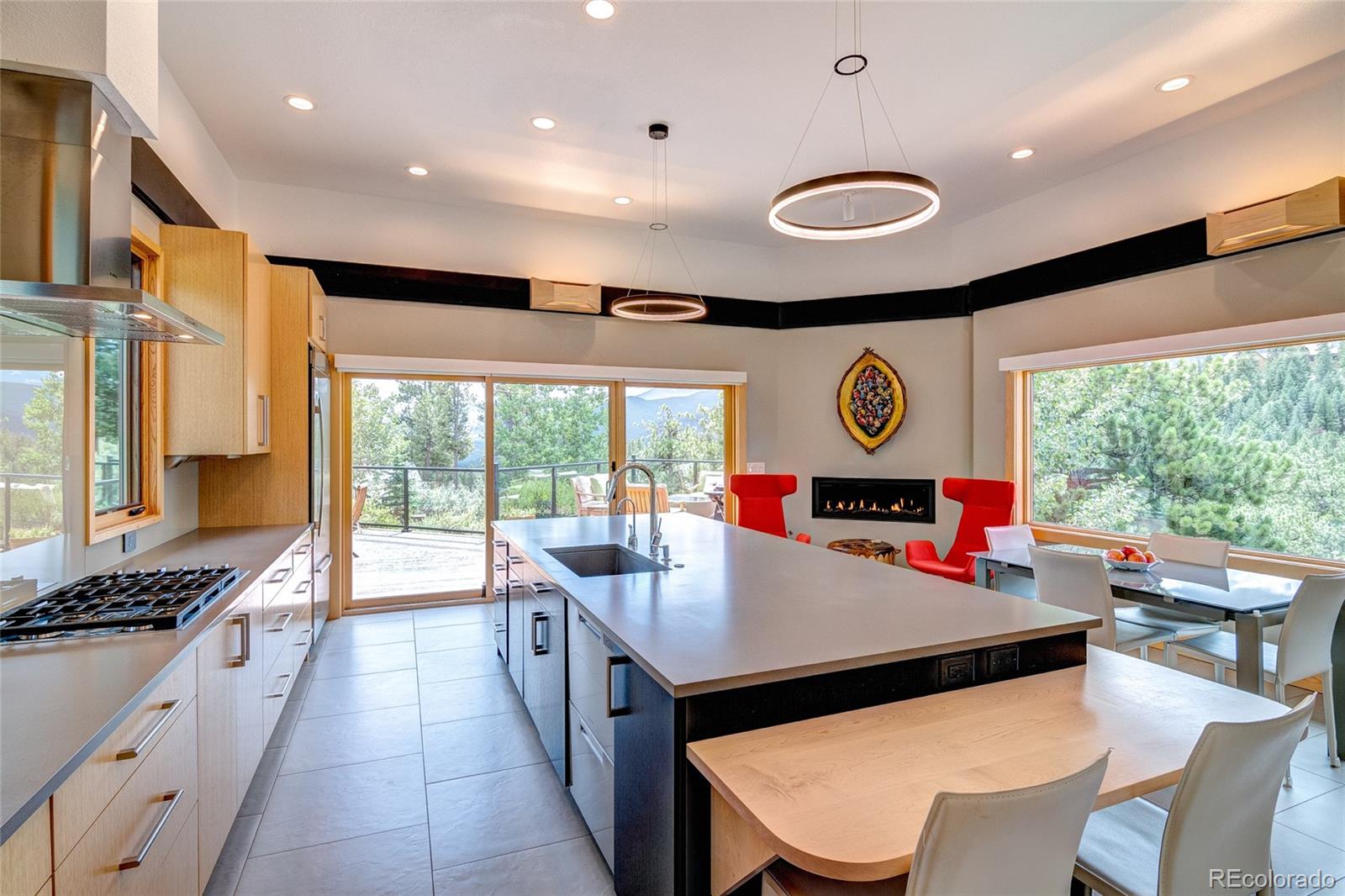 682 Buddy Road Bailey, CO 80421 - Photo 4 of 50 a kitchen with stainless steel appliances granite countertop a stove and a view of dining room