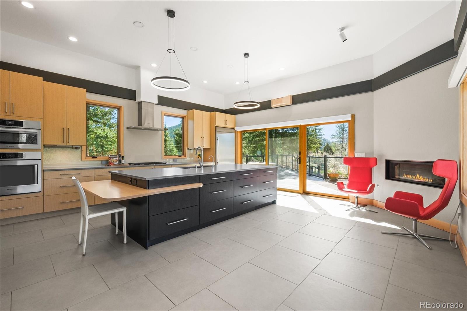 682 Buddy Road Bailey, CO 80421 - Photo 7 of 50 a room with a large window and chairs