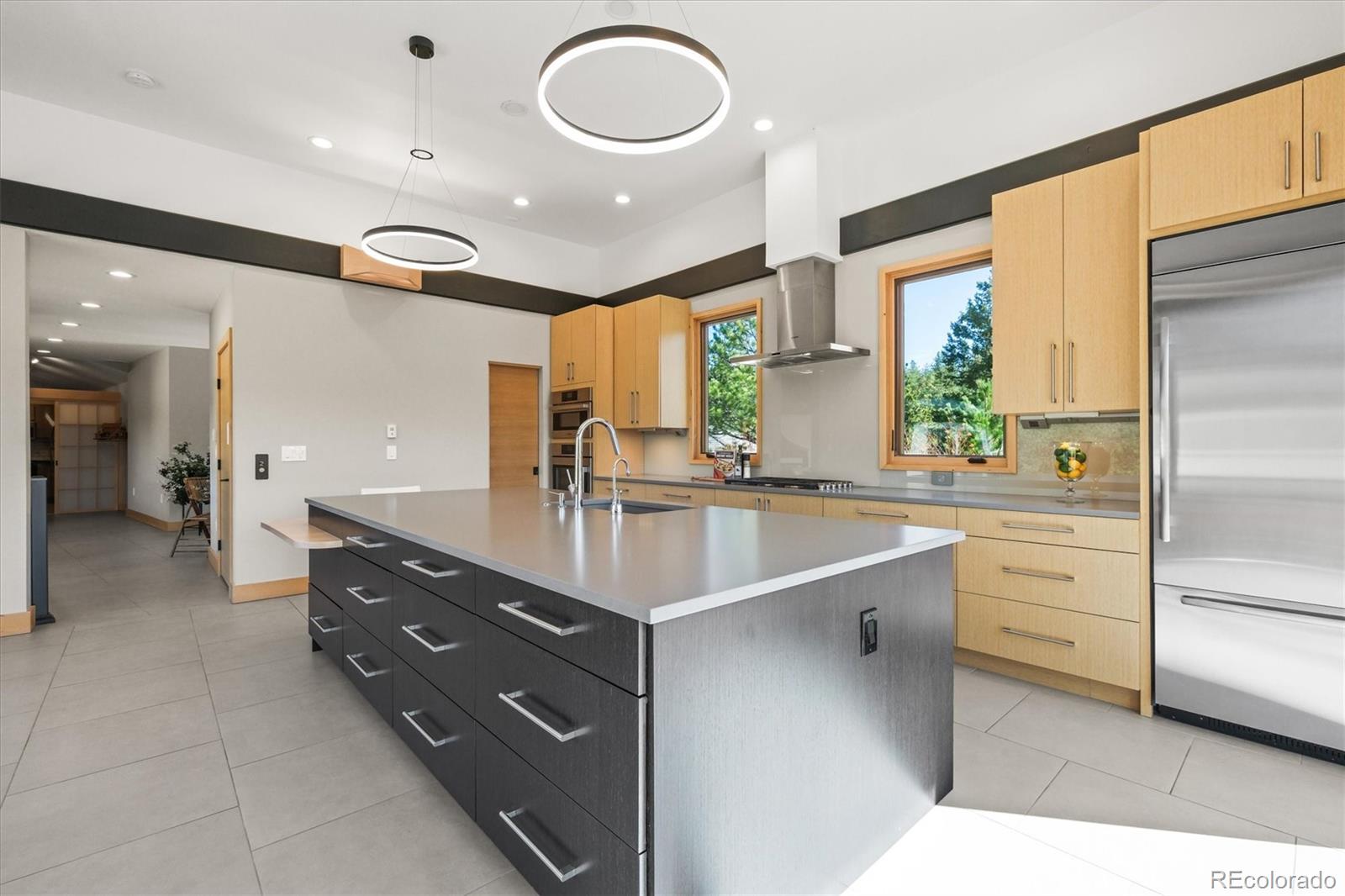 682 Buddy Road Bailey, CO 80421 - Photo 10 of 50 a spacious bathroom with a double vanity sink a large mirror and a bathtub